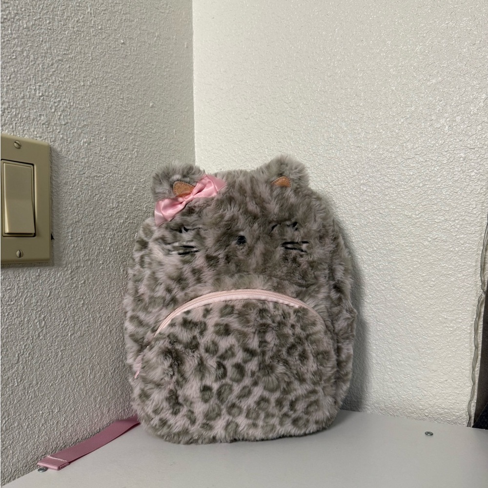 Claire’s leopard print fluffy kitty backpack